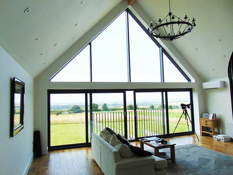 Aluminium Gable Window, Ultra Slim Patio Sliders and Bifold Doors, in a New Build Lincolnshire Wolds Property