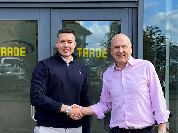 Jonathan Brewer shaking hands with Jeremy Wetherall after being promoted to Head of Sales