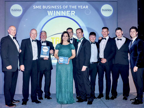 Tradeglaze staff accepting an award for SME Business of the Year for 2022