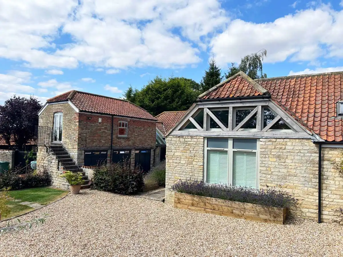 Cottage home with brand new windows and doors.